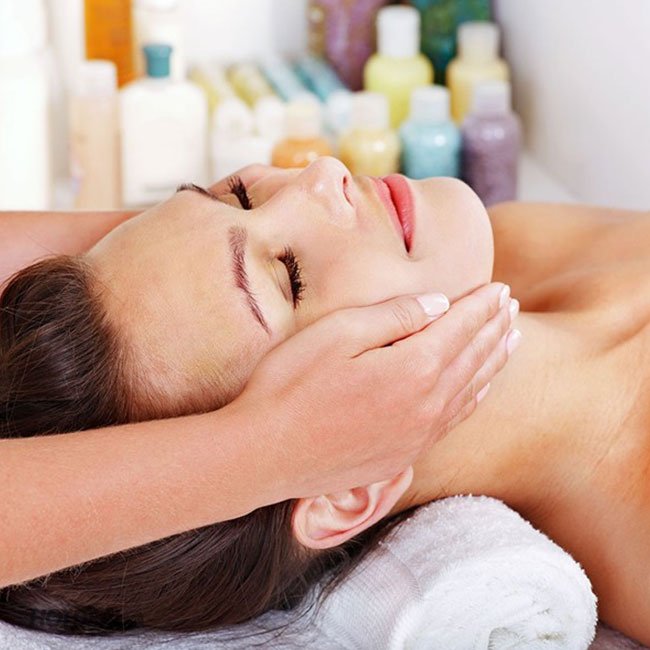 Massage face with aromatic essential oils